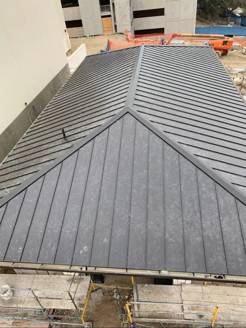 Commercial metal roof construction with crane equipment in Ville Platte
