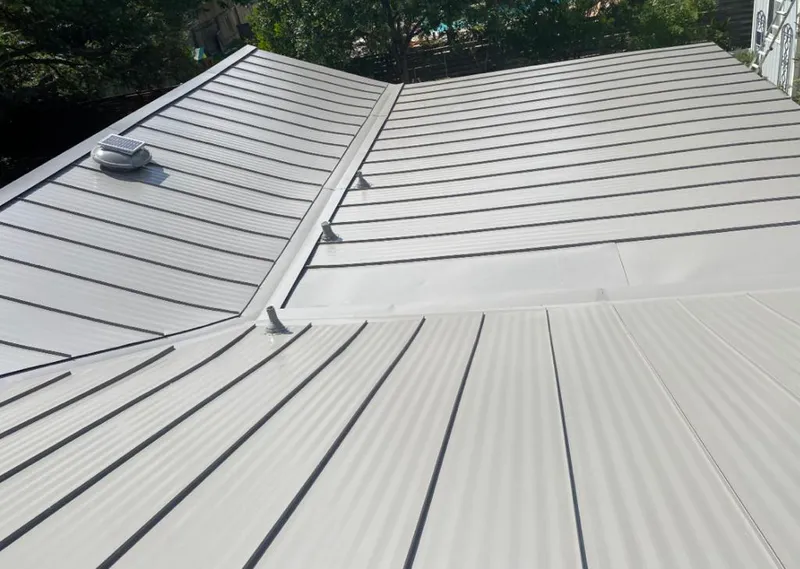 Solar attic fan installed on a metal roof for Roof Ventilation in Ville Platte